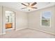 A spacious bedroom features a ceiling fan, neutral paint, and natural lighting at 3760 Ute Mountain Trl, Castle Rock, CO 80109