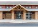 Close-up of the entrance of the community center, featuring stone pillars and a covered entryway at 3760 Ute Mountain Trl, Castle Rock, CO 80109