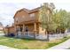 Charming two-story home with a manicured lawn, white picket fence, and inviting front porch at 3760 Ute Mountain Trl, Castle Rock, CO 80109