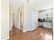 The kitchen features stainless steel appliances, white cabinets, and hardwood flooring at 3760 Ute Mountain Trl, Castle Rock, CO 80109