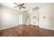 Bright living room with hardwood floors, a ceiling fan, and a staircase at 3760 Ute Mountain Trl, Castle Rock, CO 80109