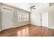 Bright living room with hardwood floors, a ceiling fan, and an abundance of natural light at 3760 Ute Mountain Trl, Castle Rock, CO 80109
