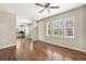 Bright living room with hardwood floors, lots of windows, and an open-concept design at 3760 Ute Mountain Trl, Castle Rock, CO 80109