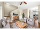 Inviting living room featuring hardwood floors, plush seating, and a decorative area rug at 3760 Ute Mountain Trl, Castle Rock, CO 80109