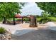 Community playground area featuring a climbing wall, picnic tables, and play structures at 3760 Ute Mountain Trl, Castle Rock, CO 80109