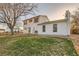 Back exterior of home with a spacious backyard and patio area at 5155 E 108Th Pl, Thornton, CO 80233