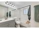 Updated bathroom with a modern vanity, tub, and neutral gray accents at 5155 E 108Th Pl, Thornton, CO 80233