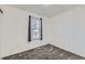 Bright bedroom features a window and neutral gray carpeting at 5155 E 108Th Pl, Thornton, CO 80233