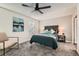 Charming bedroom features neutral walls, ceiling fan, and cozy bedding at 5155 E 108Th Pl, Thornton, CO 80233