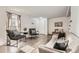 Bright and airy living room with modern furniture, neutral tones, and hardwood floors at 5155 E 108Th Pl, Thornton, CO 80233