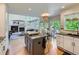 Open-concept kitchen overlooking the living room and dining area, perfect for modern living at 6366 Umber Cir, Arvada, CO 80403