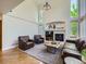 Bright living room boasts tall ceilings and a fireplace with great natural lighting and hardwood floors at 6366 Umber Cir, Arvada, CO 80403