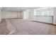 Unfinished basement space with neutral walls, carpet, and a window for natural light at 4949 Hickory Oaks St, Castle Rock, CO 80104