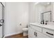 A modern bathroom featuring a walk-in shower, a vanity with black hardware, and wood-style flooring at 4949 Hickory Oaks St, Castle Rock, CO 80104