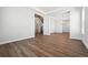 Open-concept living room with wood floors, recessed lighting, and a view of the staircase and dining area at 4949 Hickory Oaks St, Castle Rock, CO 80104