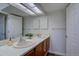Bright bathroom features a double sink vanity, a large mirror, and modern lighting at 3030 W Prentice Ave # G, Littleton, CO 80123