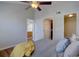 Comfortable bedroom featuring a ceiling fan, neutral paint, and connecting doors at 3030 W Prentice Ave # G, Littleton, CO 80123