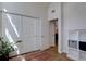 Hallway with multiple doors, a built-in shelving unit, and stylish flooring at 3030 W Prentice Ave # G, Littleton, CO 80123