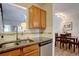 Well-lit kitchen featuring stainless steel appliances, granite countertops, and a convenient double sink at 3030 W Prentice Ave # G, Littleton, CO 80123