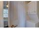Convenient laundry area featuring a stacked washer and dryer near the bedroom at 3030 W Prentice Ave # G, Littleton, CO 80123