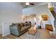 Inviting living room featuring vaulted ceilings, wood floors, and an open layout to the kitchen at 3030 W Prentice Ave # G, Littleton, CO 80123