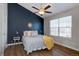 Stylish main bedroom featuring vaulted ceilings, a fan, and large window at 3030 W Prentice Ave # G, Littleton, CO 80123
