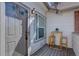 Cozy outdoor patio with wooden table and chairs, perfect for enjoying morning coffee at 3030 W Prentice Ave # G, Littleton, CO 80123