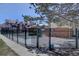 Community pool area surrounded by a secure fence and lush landscaping at 3030 W Prentice Ave # G, Littleton, CO 80123