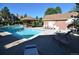 Community pool area with a gazebo, lounge chairs, tables and chairs on a sunny day at 3030 W Prentice Ave # G, Littleton, CO 80123