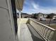 Balcony view showcasing neighborhood homes and bright blue skies at 13013 Grant Cir # C, Thornton, CO 80241