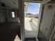 View from living room out to the balcony that overlooks the neighborhood at 13013 Grant Cir # C, Thornton, CO 80241