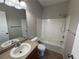 Clean bathroom with a tub, shower and a single sink vanity at 13013 Grant Cir # C, Thornton, CO 80241