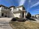 Charming two-story home with a balcony, attached garages, and a well-maintained front yard at 13013 Grant Cir # C, Thornton, CO 80241