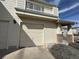 Exterior shot of an attached one-car garage, featuring brick accents on the home's facade at 13013 Grant Cir # C, Thornton, CO 80241