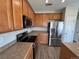 Modern kitchen with stainless steel appliances, ample counter space, and lots of cabinet space at 13013 Grant Cir # C, Thornton, CO 80241