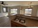Modern kitchen featuring a stainless steel sink, spacious countertop, and abundant natural light from large windows at 13013 Grant Cir # C, Thornton, CO 80241