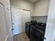 Convenient laundry room featuring appliances and a closet for extra storage at 13013 Grant Cir # C, Thornton, CO 80241