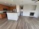 Spacious living room with open floor plan, featuring a fireplace, kitchen and hardwood floors at 13013 Grant Cir # C, Thornton, CO 80241