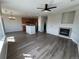 Open-concept living space with hardwood floors, a fireplace, and a modern kitchen at 13013 Grant Cir # C, Thornton, CO 80241
