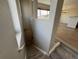 Carpeted staircase leads to the living room with hard wood floors and plenty of natural lighting at 13013 Grant Cir # C, Thornton, CO 80241
