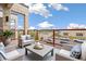 Relaxing balcony featuring comfortable seating and views of the surrounding neighborhood at 5668 Galena St, Denver, CO 80238