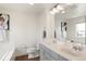 Bathroom with double vanity, modern fixtures, and art at 5668 Galena St, Denver, CO 80238