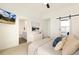 Bedroom featuring modern decor, ensuite bath, and a sliding door closet at 5668 Galena St, Denver, CO 80238