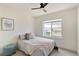 Bright bedroom with a large window, and modern decor at 5668 Galena St, Denver, CO 80238