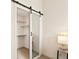Walk-in closet with a sliding mirror door and wire shelving at 5668 Galena St, Denver, CO 80238