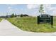 North Commons Lawn park sign surrounded by lush greenery and walking path at 5668 Galena St, Denver, CO 80238