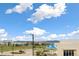 This shot overlooks the surrounding neighborhood with parking, a playground, and commercial building in the distance at 5668 Galena St, Denver, CO 80238