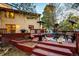 Cozy back deck with multiple seating areas, heaters, and outdoor grill at 11437 Tomichi Dr, Franktown, CO 80116