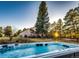 Backyard with hot tub, grass area, and wooden deck perfect for relaxation at 11437 Tomichi Dr, Franktown, CO 80116