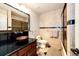 Updated bathroom featuring granite countertops, a decorative sink, and a tiled shower at 11437 Tomichi Dr, Franktown, CO 80116